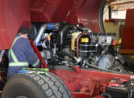 mechanic working on a pumper truck